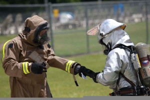 A_member_of_the_Marine_Corps_Air_Station_Beaufort_fire_department_is_helped_out_of_his_HAZMAT_suit_as_he_goes_through_a_decontamination_center_at_the_sight_chemical_spill_at_the_training